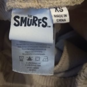Sweat pants with smurfs on them.size xs. By the smurfs tm